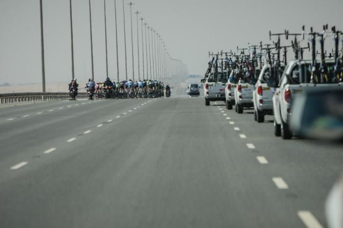 The peloton races down one of Qatars main highways.