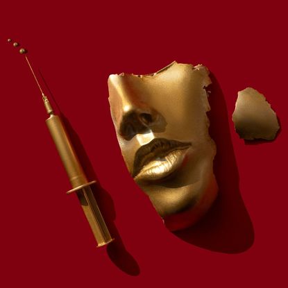 Gold colored syringe and face/ mask on the red background, symbolising masseter Botox