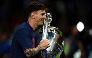 Lionel Messi celebrates winning the Champions League for the fourth time