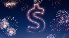 Night sky with fireworks shaped as a Dollar symbol