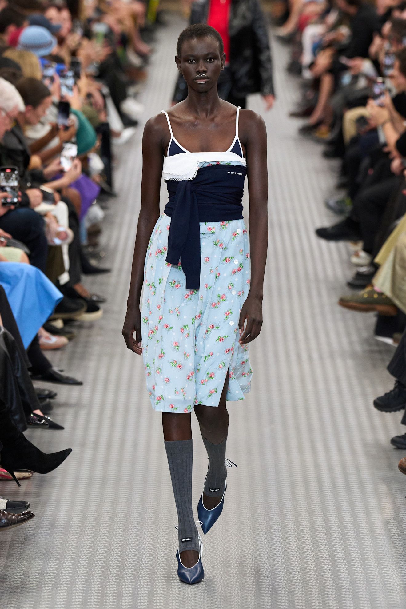 Model wears the baby blue color trend on the runway.