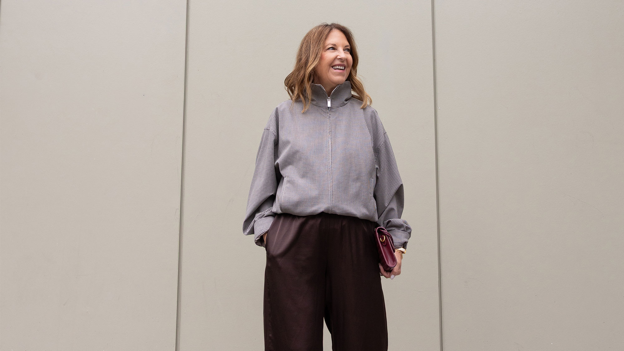 Sandy Koszarek wearing a track jacket and brown trousers.