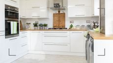 white kitchen with wooden worktops 