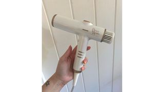 Original image of hand holding the Beauty Works AERIS Dryer