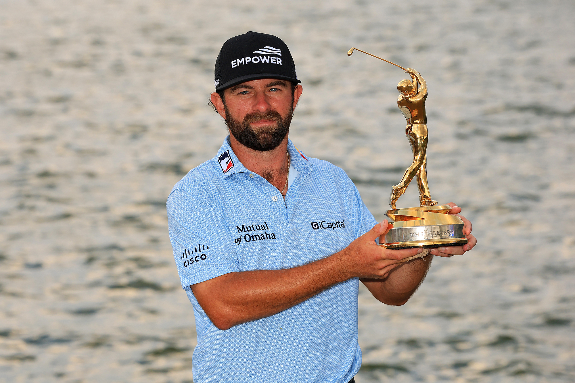 Cameron Young holding the Players Championship trophy after winning at TPC Sawgrass in March 2026