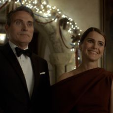 hal and kate wyler smiling and dressed in formal wear at an event in the diplomat