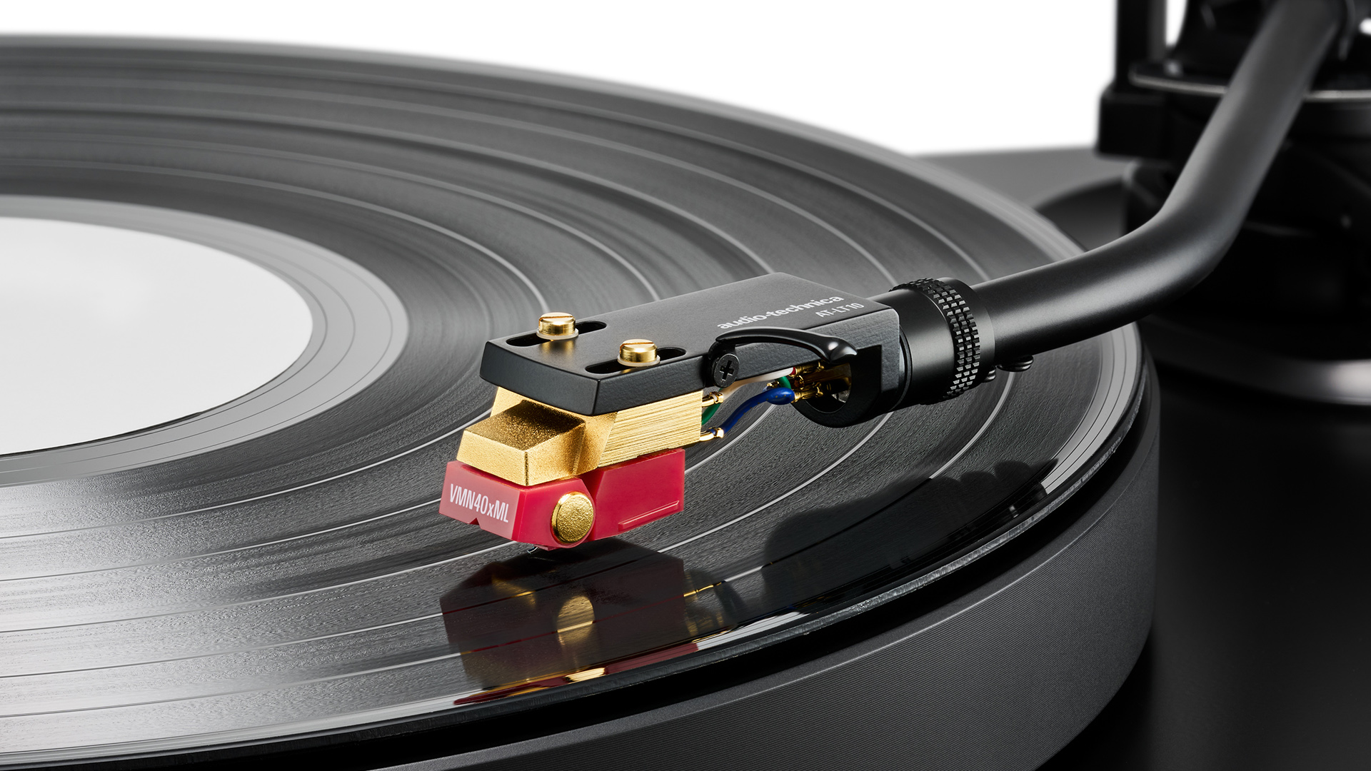 Audio-Technica AT-VM740xML moving magnet cartridge playing black vinyl record