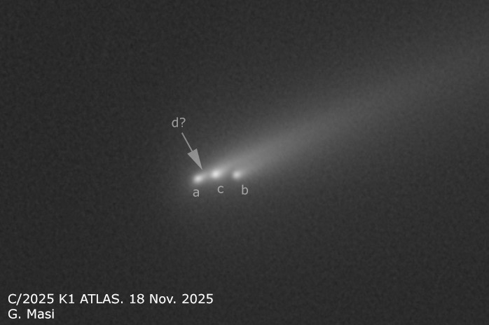 four blurry white blobs on a black background