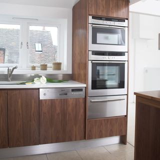 kitchen with dishwasher and wooden cabinets
