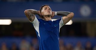 Chelsea star Enzo Fernandez looks dejected after missing a goal scoring opportunity during the Premier League match between Chelsea FC and Luton Town at Stamford Bridge on August 25, 2023 in London, England.