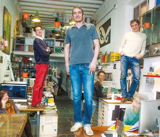Cacao Design was founded in 2004 by Masa Magnoni, Alessandro Floridia and Mauro Pastore (standing on the desks, left to right). It specialises in branding, web design and below-the-line campaigns
