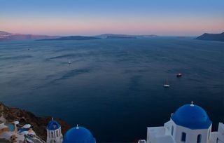 The view from Santorini — with a perfect sky