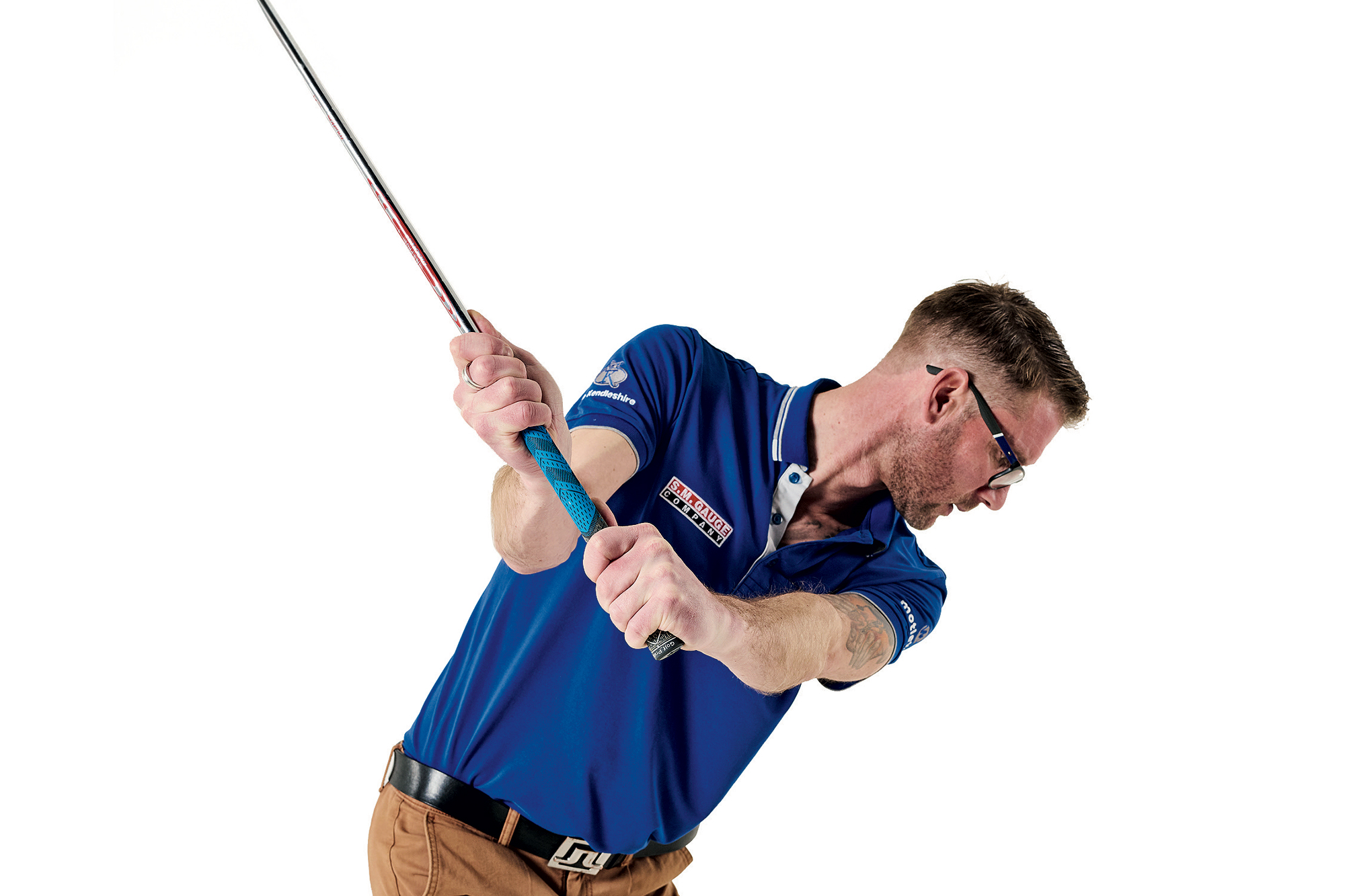 Tom Motley from down the line showcasing the connection in the golf swing during the backswing