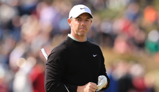 Rory McIlroy watches on the putting green