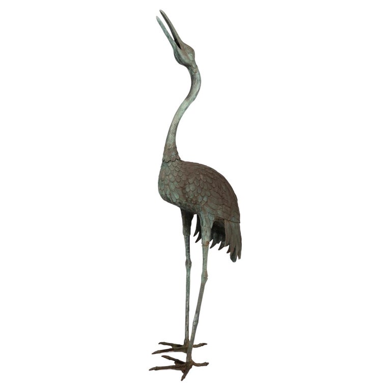 A Japanese Bronze Garden Statue of a Crane