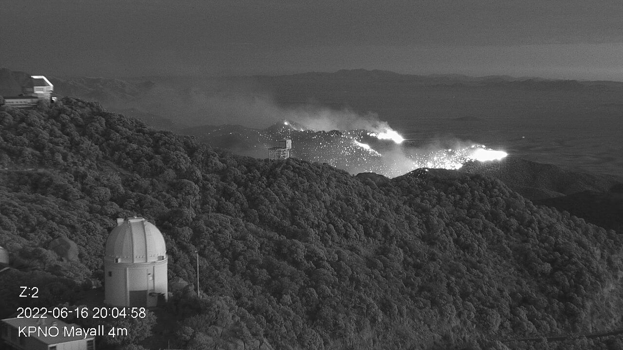 A view of the Contreras Fire burning the slopes of Kitt Peak mountain late on June 16, 2022.