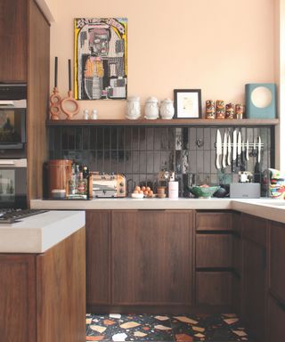 Kitchen with terrazzo floors and dark brown wood cabinetry