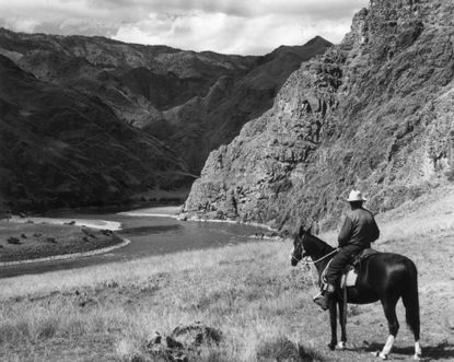 A man sits on horseback at the Hells Canyon National Recreation Area, Oregon, in 1955.