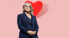 Esther Perel standing in front of heart-shaped balloon to represent how to initiate sex after dry spell