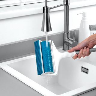 lint roller with hand and faucet