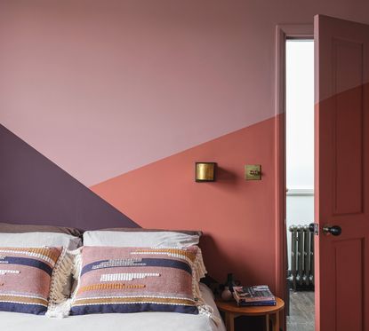 pink bedroom with pink painted door