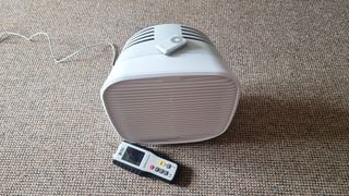 The Oransi Airmend air purifier and an air particle monitor