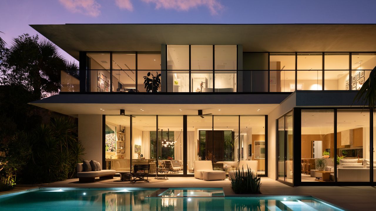 A waterfront house in Miami is arranged as a sequence of densely planted courtyards