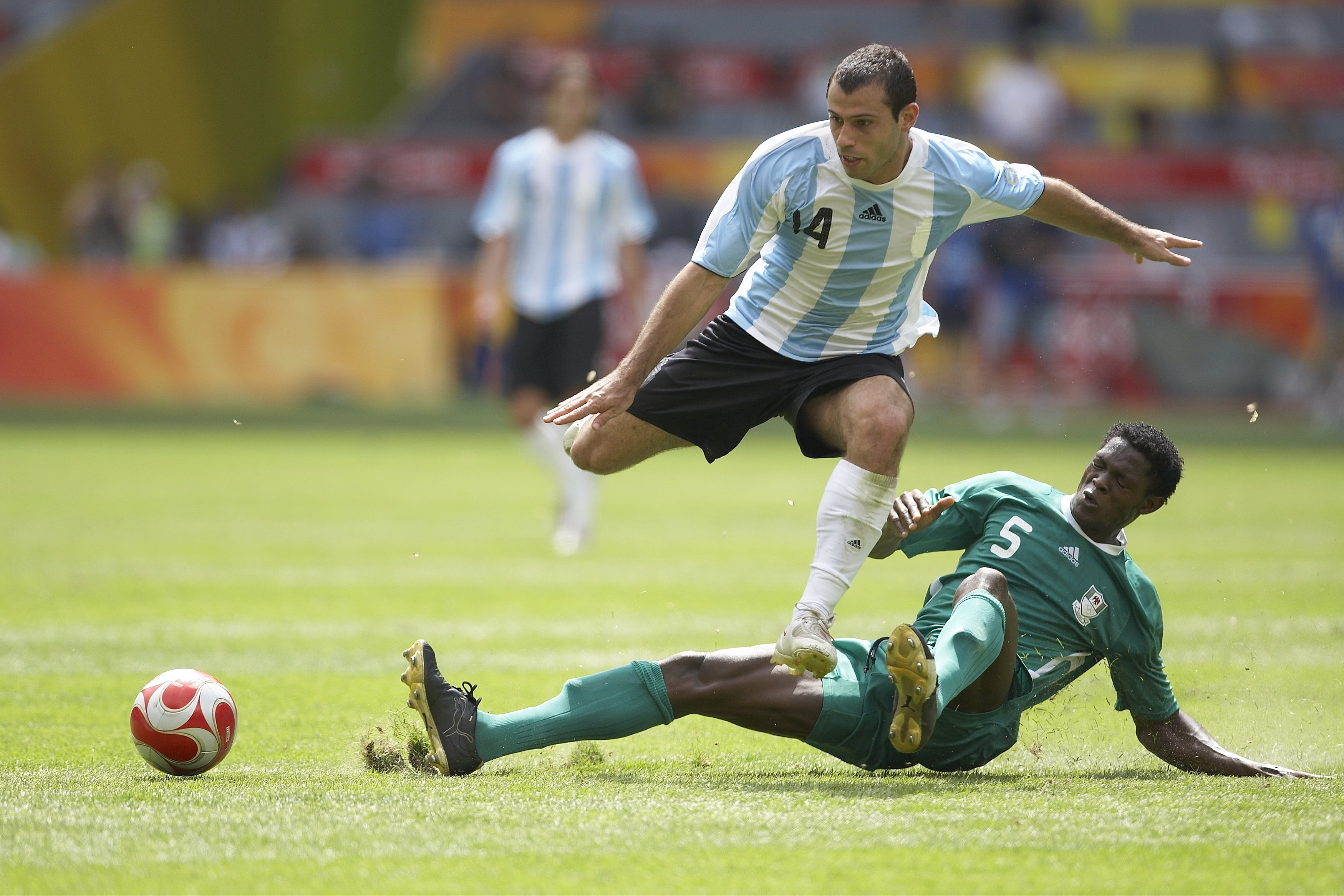 Nigeria's Dele Adeleye slides in to tackle Argentina's Javier Mascherano in the 2008 Olympic men's football final in Beijing.