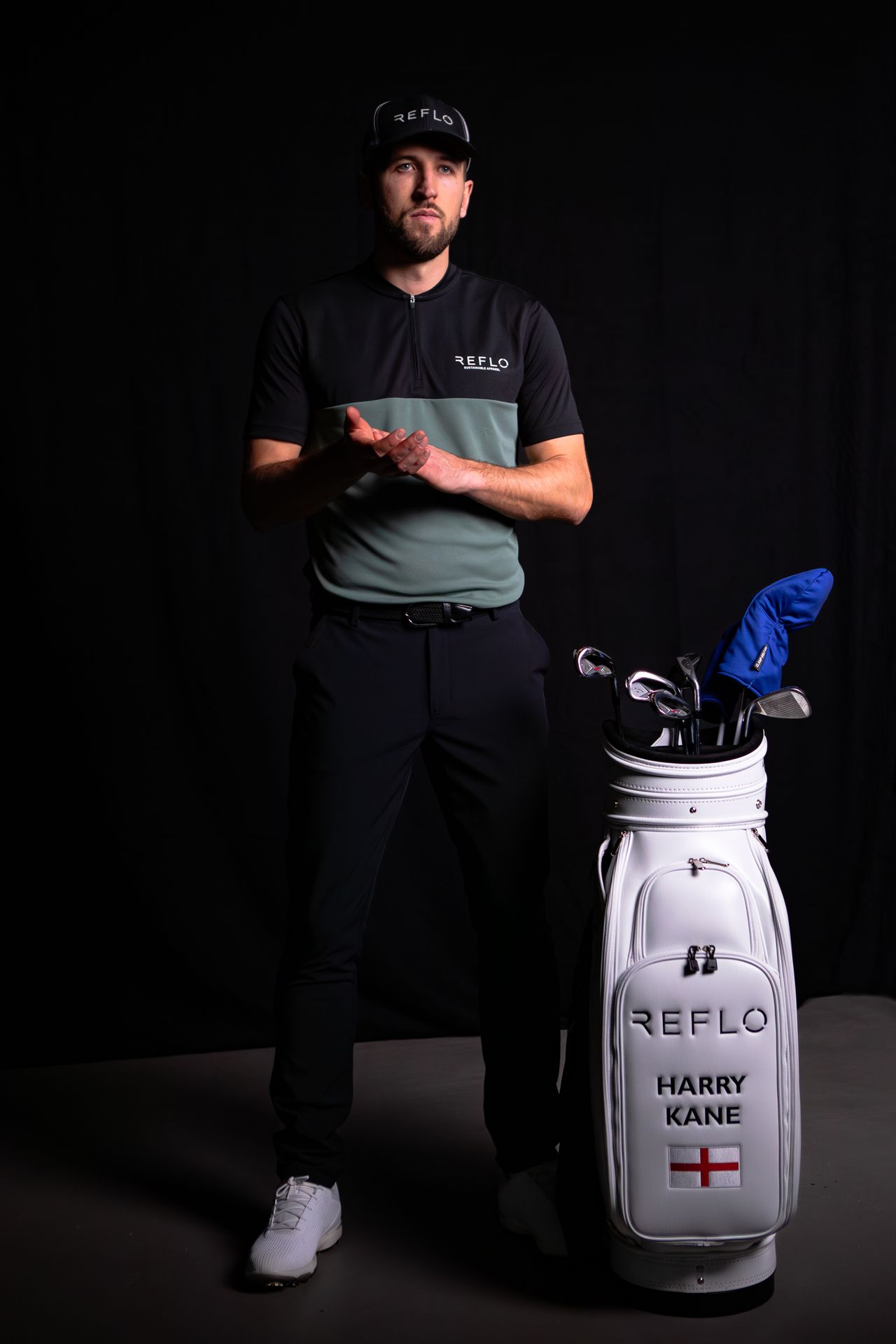 Harry Kane wearing the Tobol green and black polo shirt from Reflo