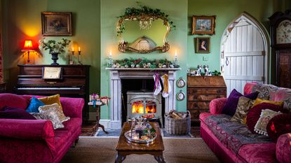 living room dressed for Christmas with bright colors and gothic door