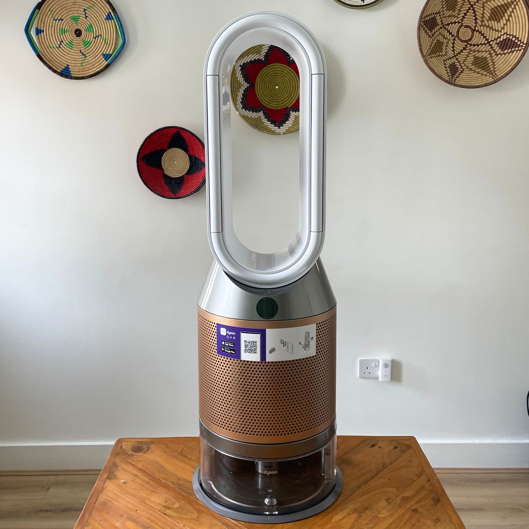 Dyson Purifier Humidify+Cool PH2 De-Nox in white and gold sitting on wooden table