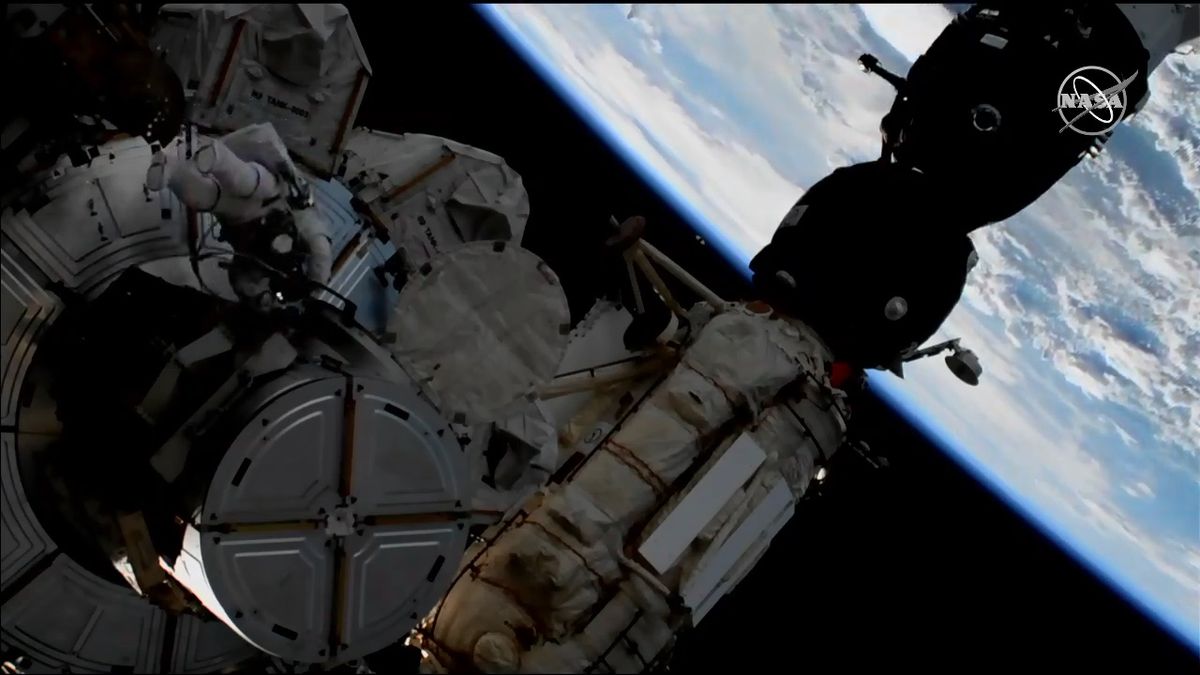 NASA astronaut Anne McClain emerges from the Quest airlock at the beginning of today's spacewalk.