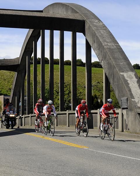 The lead group cross the bridge at Mataura