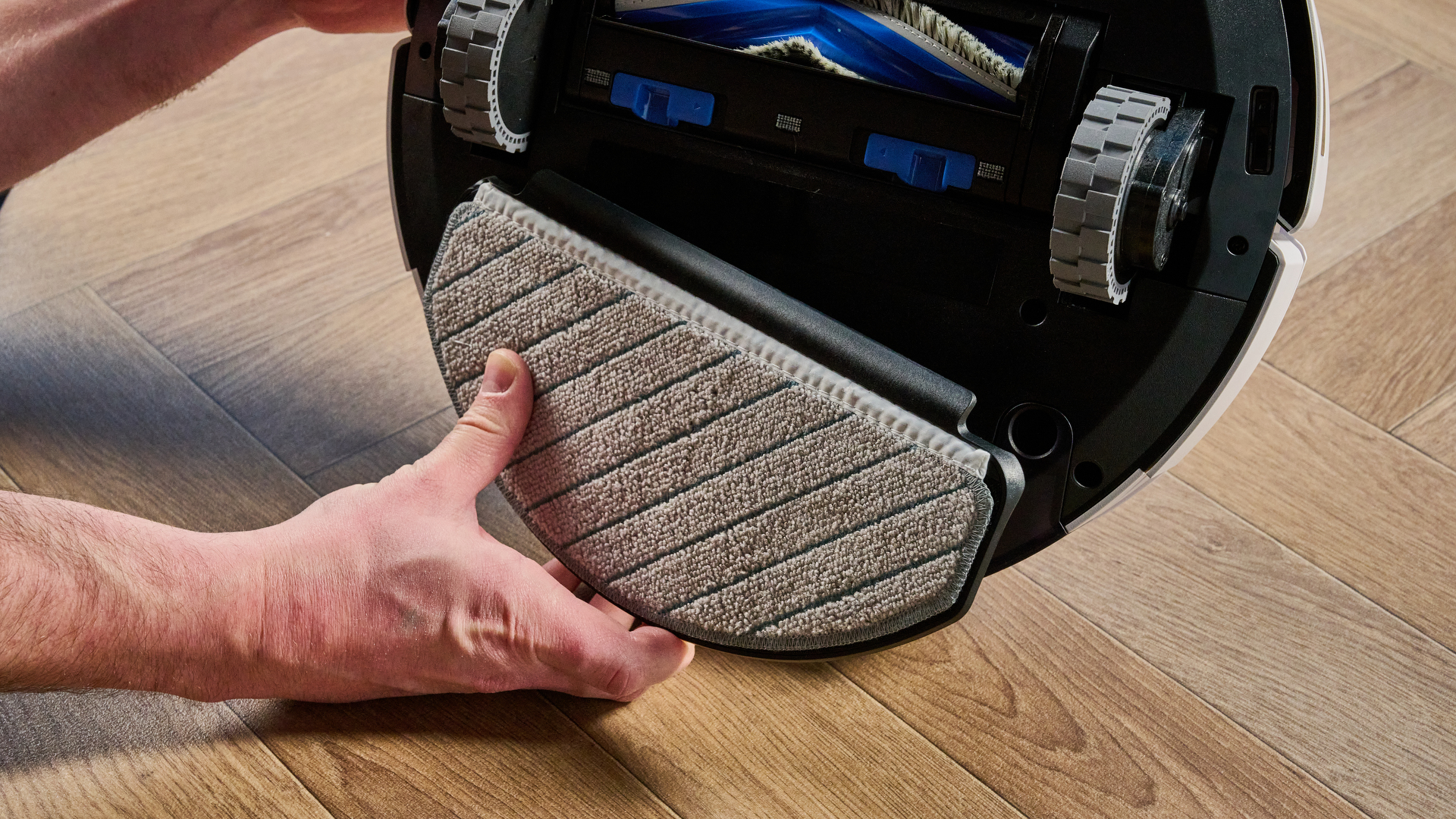 Ecovacs Deebot N20 in white photographed vacuuming floor