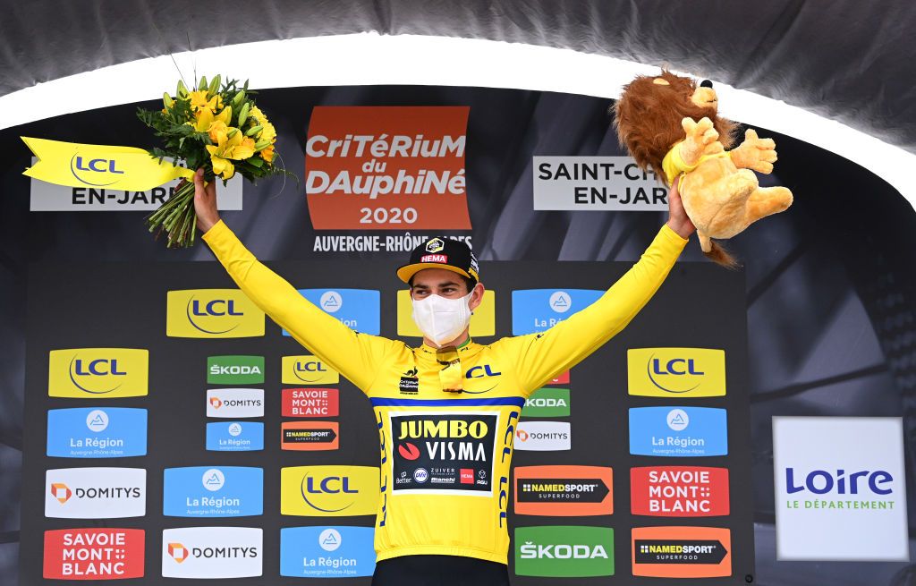 SAINT CHRISTO EN JAREZ FRANCE AUGUST 12 Podium Wout Van Aert of Belgium and Team Jumbo Visma Yellow Leader Jersey Celebration Flowers Covid safety measures Mascot during the 72nd Criterium du Dauphine 2020 Stage 1 a 2185km stage from Clermont Ferrand to Saint Christo en Jarez 752m dauphine Dauphin on August 12 2020 in Saint Christo en Jarez France Photo by AnneChristine Poujoulat PoolGetty Images