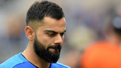 India captain Virat Kohli reacts at the end of the semi-final defeat to New Zealand