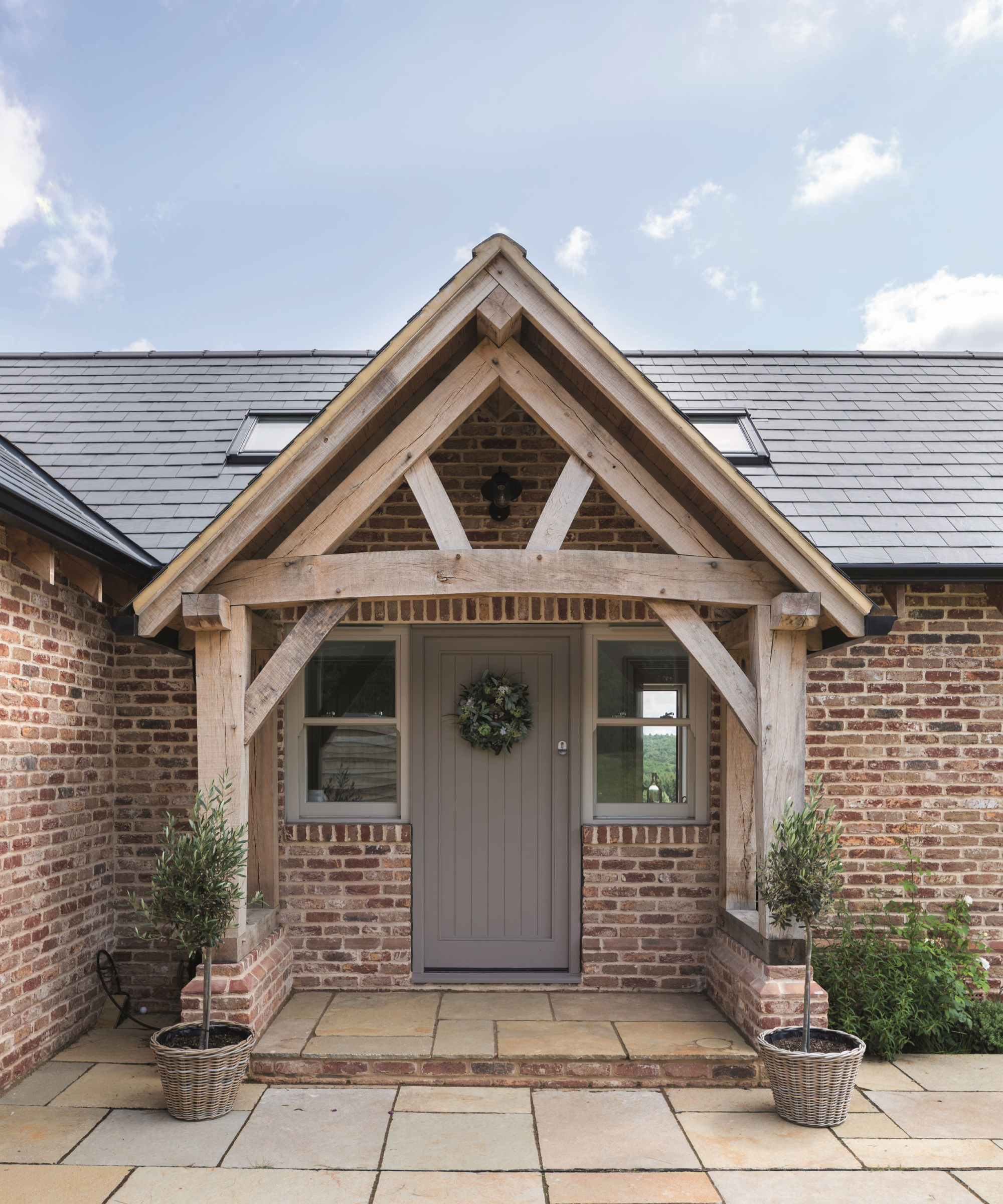large oak porch on single storey timber frame home