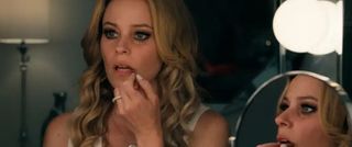 Elizabeth Banks looks in the mirror at her makeup stars in 'Skincare'