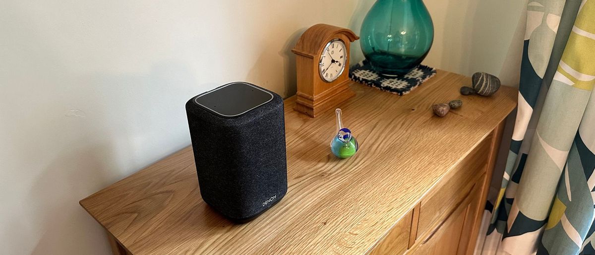 Denon Wireless speaker 150 on a wooden side table