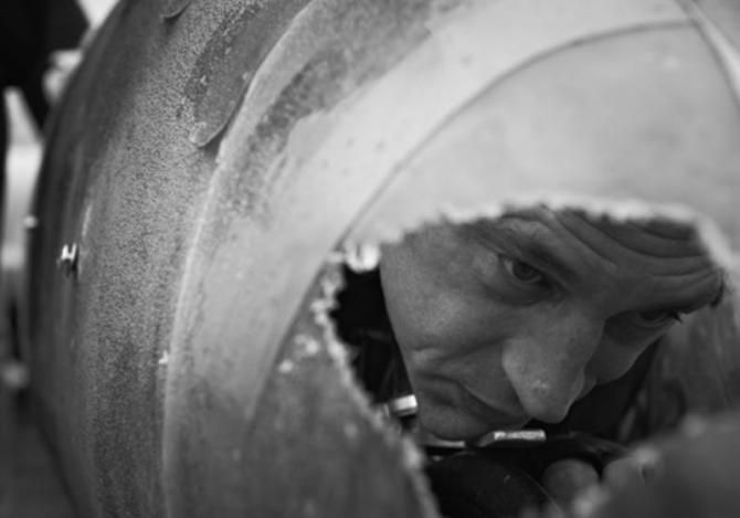 Obree peers through the hole drilled in the Beastie's shell for visibility purposes