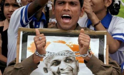A supporter of Indian activist Anna Hazare protests the arrest of the 74-year-old Gandhi devotee.