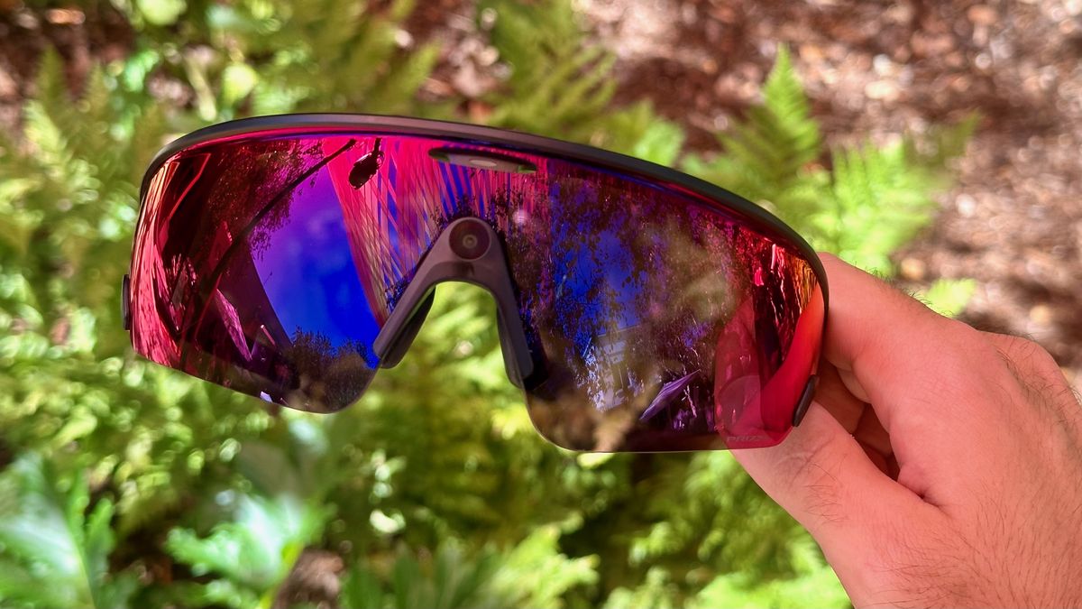 Photo of the Oakley Meta Vanguard smart glasses held in hand.