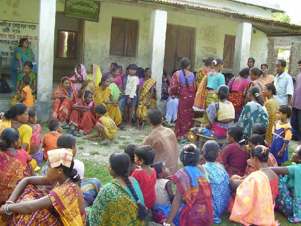 Women in a government loan program meet to discuss witch hunts in India&#039;s Jalpaiguri district. 