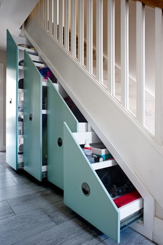 Hallway storage in under stairs space by Avar Furniture