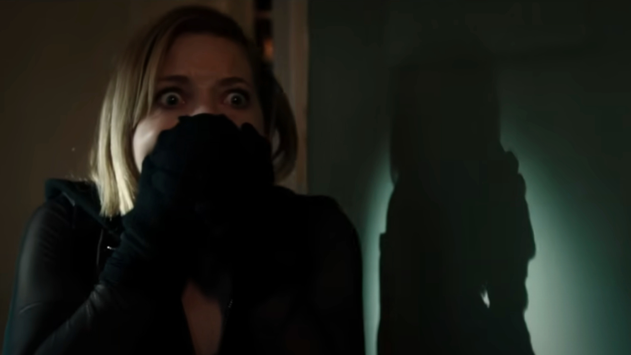 Jane Levy clasping her hands over her mouth in Don't Breathe