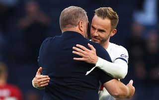 James Maddison and Ange Postecoglou embrace after Tottenham beat Manchester United