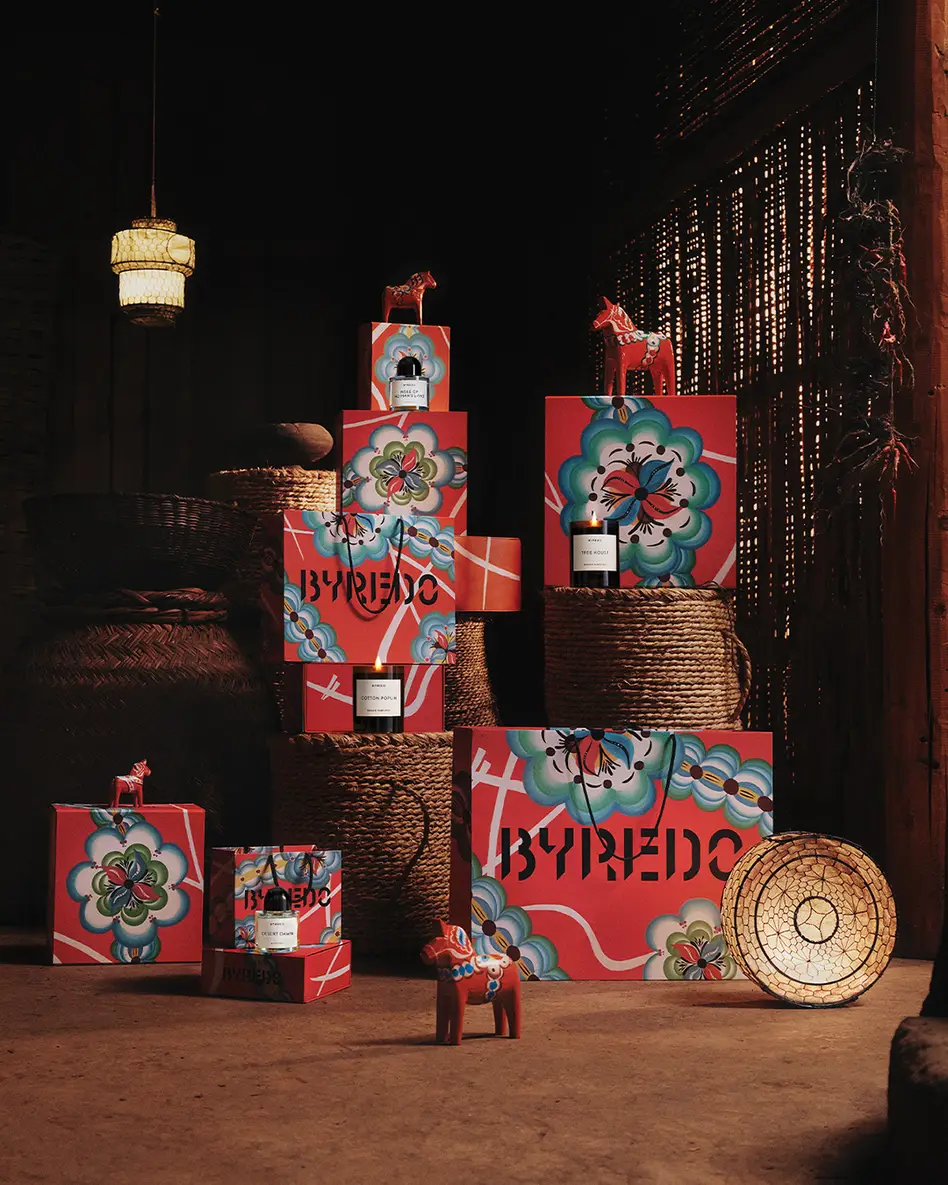 stack of byredo bags with red horse statures, rattan woven baskets, and byredo scents