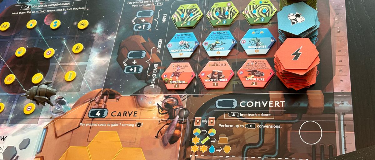 Apiary board filled with tokens, models, and sci-fi imagery