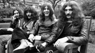 Black Sabbath sitting on a park bench in 1970