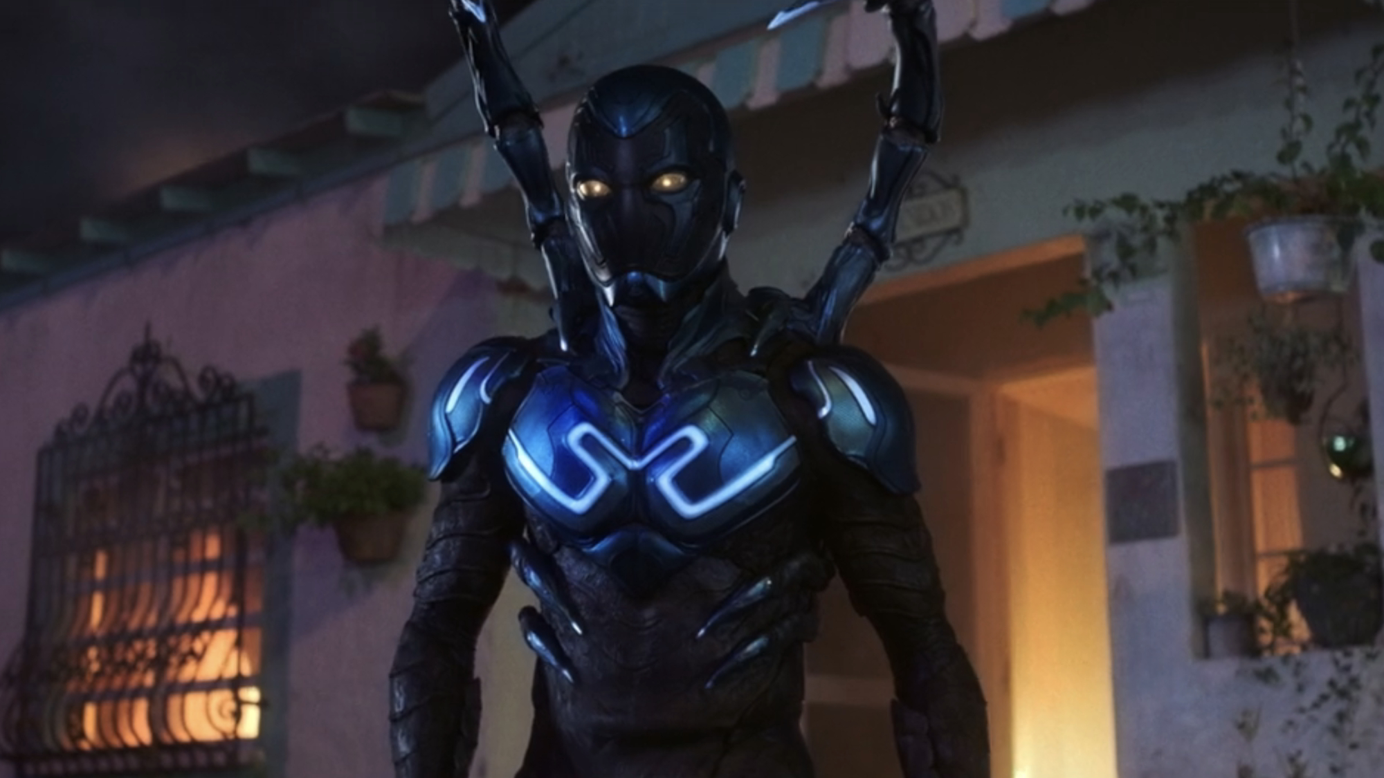 Blue Beetle stands in front of his house in Blue Beetle.